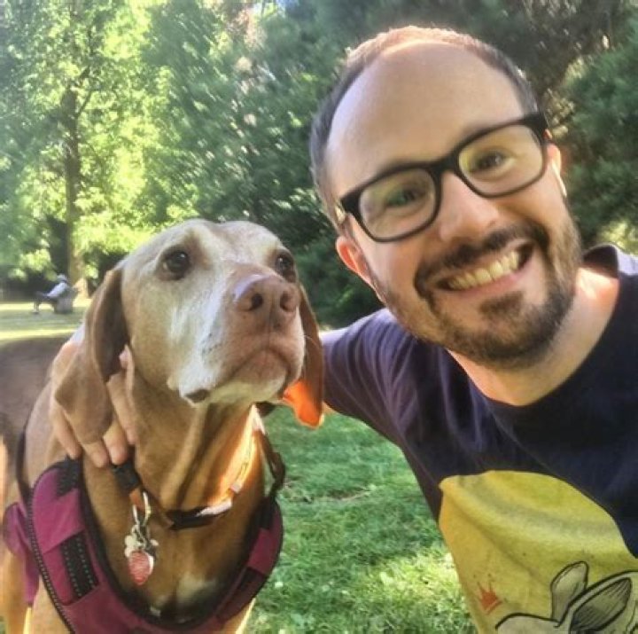 Matt Baume with a dog